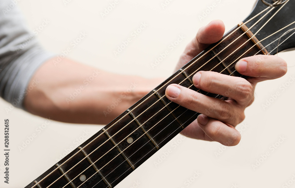 Fototapeta premium Selective focus,Guitarist,The musicians are catching the guitar chords calling C chord on white background