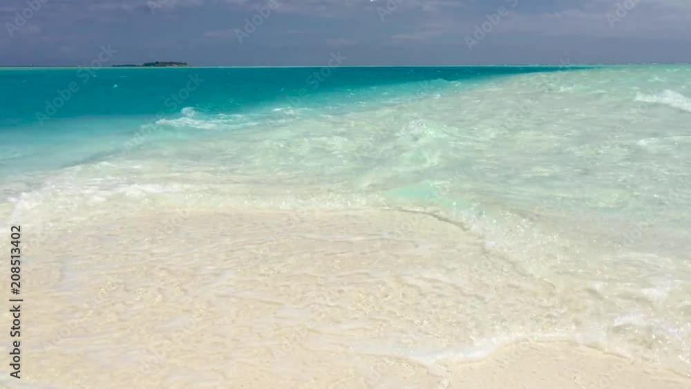 Small waves on a wonderful tropical beach Small waves on a wonderful tropical beach
