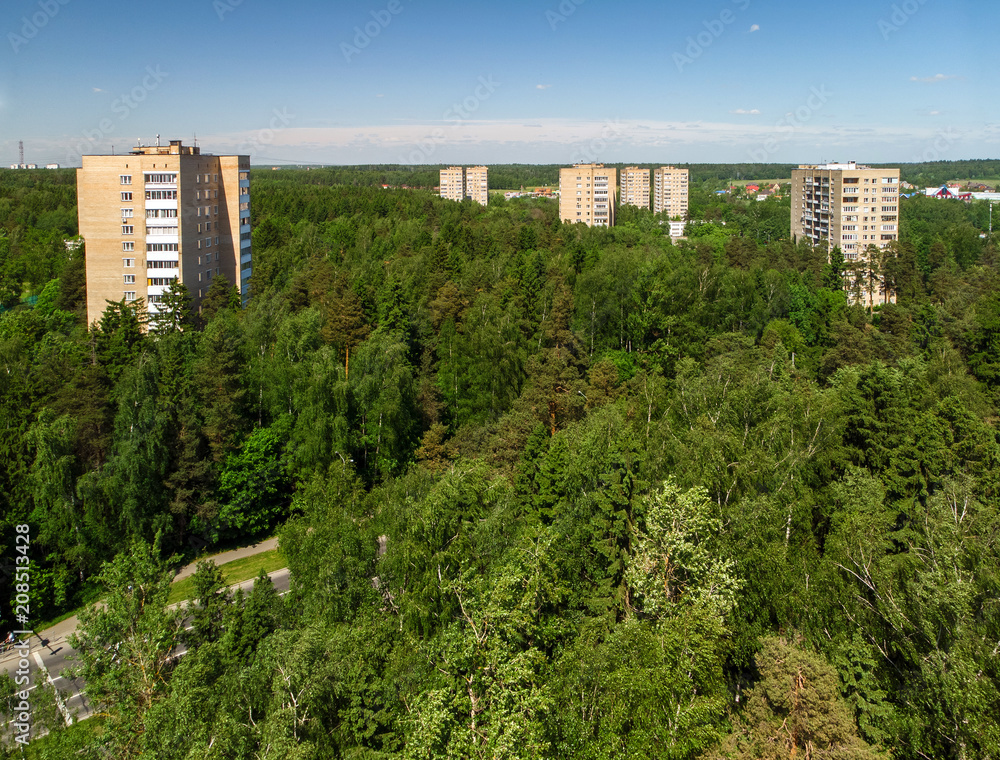 Top view of house in forest in Moscow, Russia.