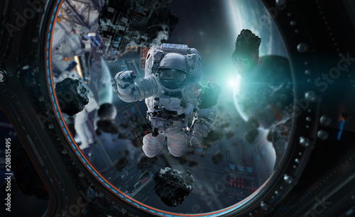 Fototapeta Naklejka Na Ścianę i Meble -  Astronaut working on a space station 3D rendering elements of this image furnished by NASA
