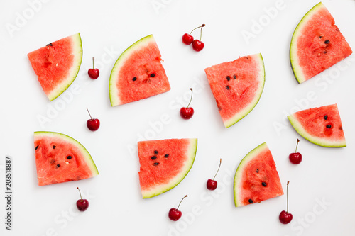 Fototapeta Naklejka Na Ścianę i Meble -  Pieces of watermelon and cherries on a white background