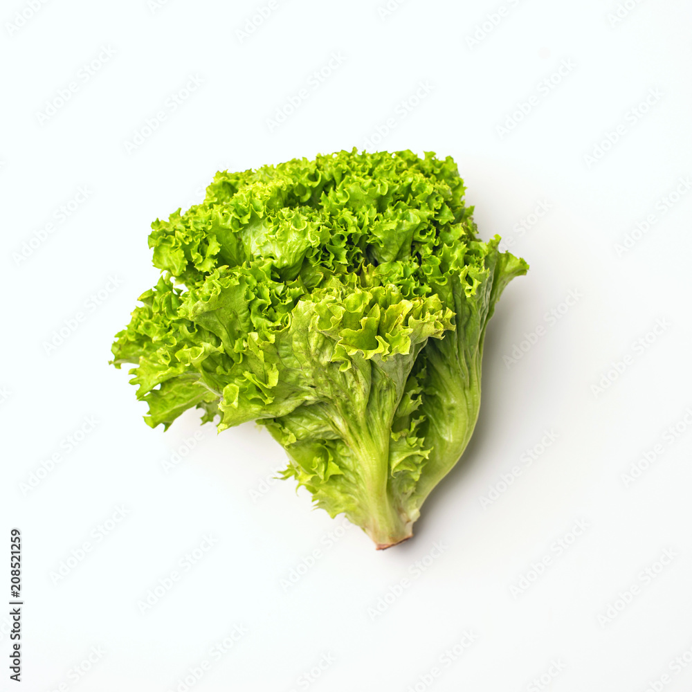 Green vegetables flat lay concept. lettuce salad on white background, top view with empty space for text.