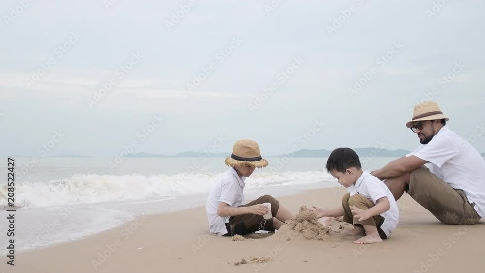 happy family with two kids on the beach, Happy family on sea beach at resort happy family with two kids on the beach, Happy family on sea beach at resort