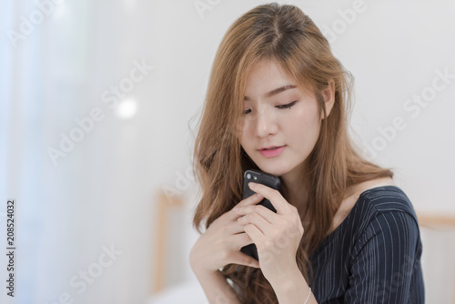cute girl use phone in room