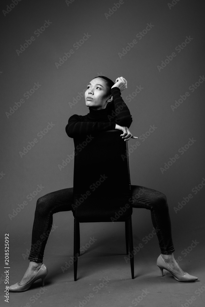 Black And White Portrait Of Asian Transgender Woman Sitting