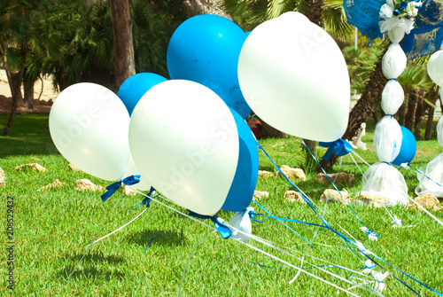 Wedding decoration blue and white ballons. Outdoor ceremony with floral composition and beautiful arhc. photo