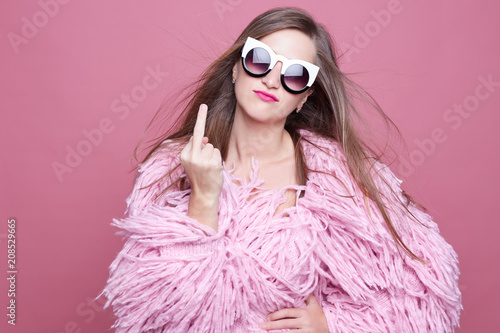 Tableau sur toile Nervous outraged posh diva with linked teeth, gestures fuck you in anger, being irritated on boyfriend who is late for date