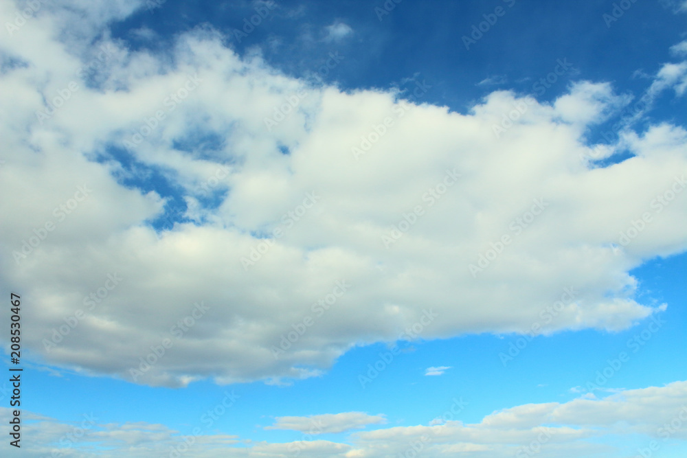 Beautiful natural blue sky and white fluffy clouds. Background. Landscape. Beautiful natural blue sky and white fluffy clouds. Background. Landscape.