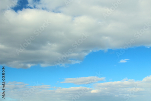 Beautiful natural blue sky and white fluffy clouds. Background. Landscape. © far700