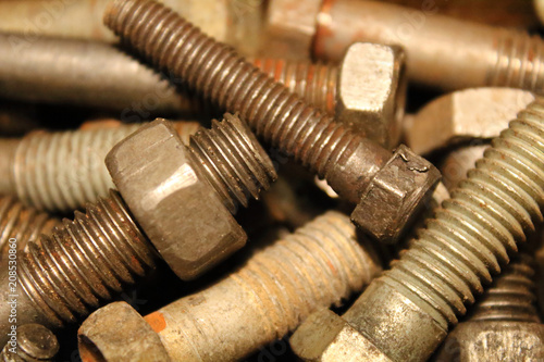 Old large metal bolts. Close-up. Texture. Background.