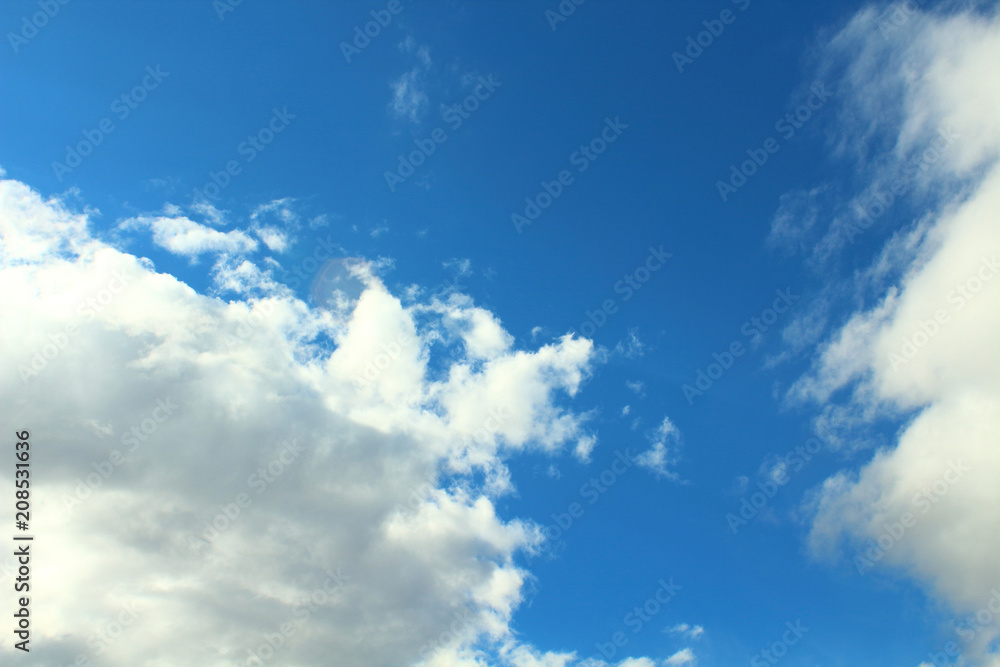 Beautiful blue sky and fluffy white gray clouds. Background. Landscape. Natural appearance. Beautiful blue sky and fluffy white gray clouds. Background. Landscape. Natural appearance.