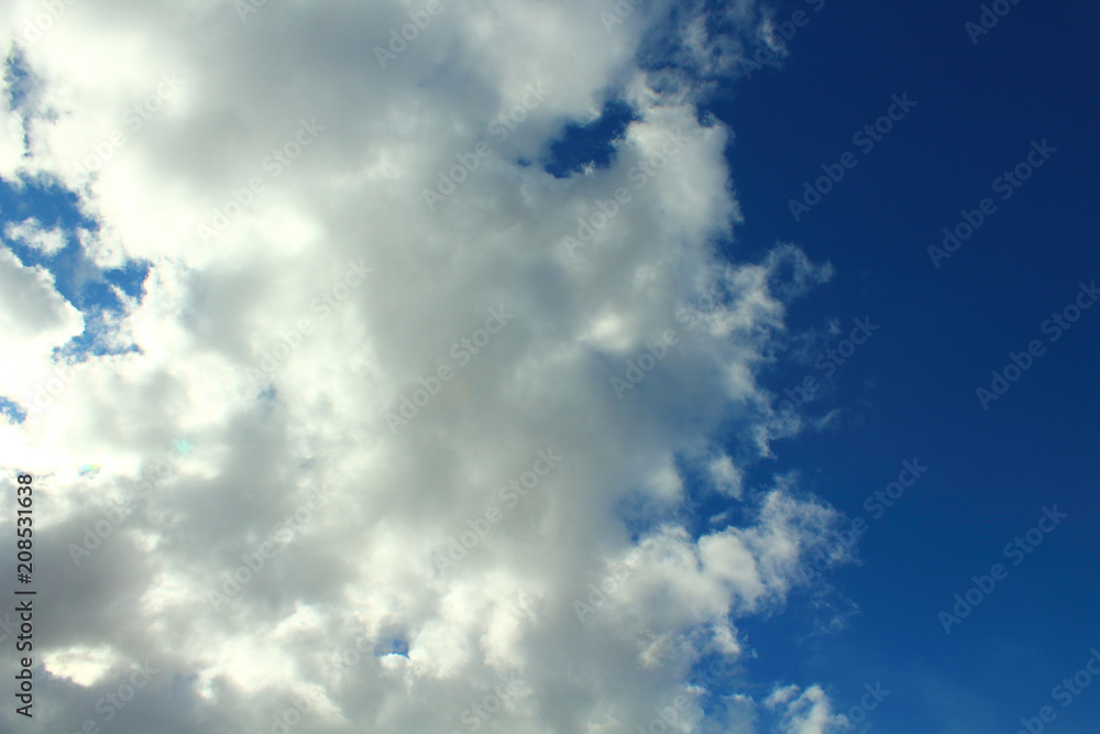 Obraz premium Beautiful natural blue sky and white fluffy clouds. Background. Landscape.