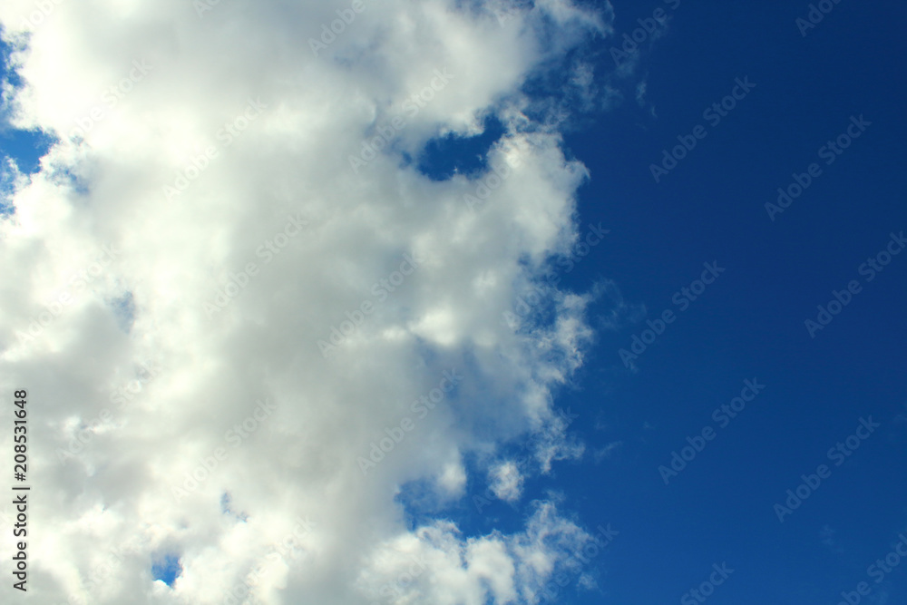 Fototapeta premium Beautiful natural blue sky and white fluffy clouds. Background. Landscape.