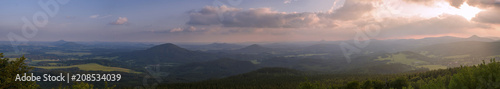 Lusatian Mountains  luzicke hory  wide panorama  panoramic view from Hochwald  Hvozd  mountain on czech german borders with blue green hills forest and pink cloudy sunset sky  background