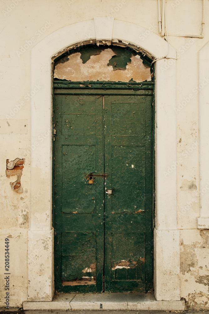 Old green wooden door in old abandoned bulding in Gibraltar. Old green wooden door in old abandoned bulding in Gibraltar.