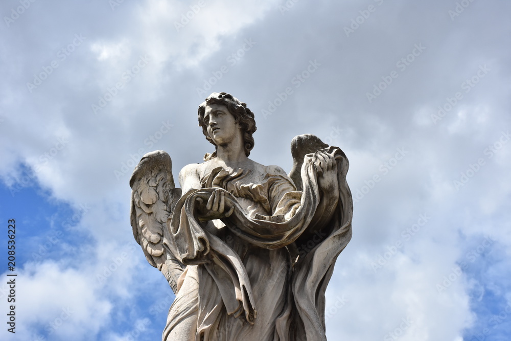 Rome, statues of the angels sculpted by pupils of Bernini in 1669 and placed on the S. Angelo bridge. Details and close-up Rome, statues of the angels sculpted by pupils of Bernini in 1669 and placed on the S. Angelo bridge. Details and close-up