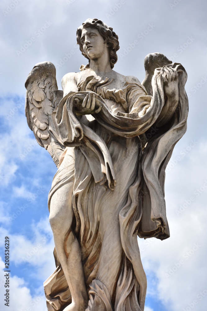 Rome, statues of the angels sculpted by pupils of Bernini in 1669 and placed on the S. Angelo bridge. Details and close-up Rome, statues of the angels sculpted by pupils of Bernini in 1669 and placed on the S. Angelo bridge. Details and close-up