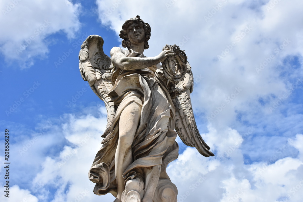 Rome, statues of the angels sculpted by pupils of Bernini in 1669 and placed on the S. Angelo bridge. Details and close-up Rome, statues of the angels sculpted by pupils of Bernini in 1669 and placed on the S. Angelo bridge. Details and close-up