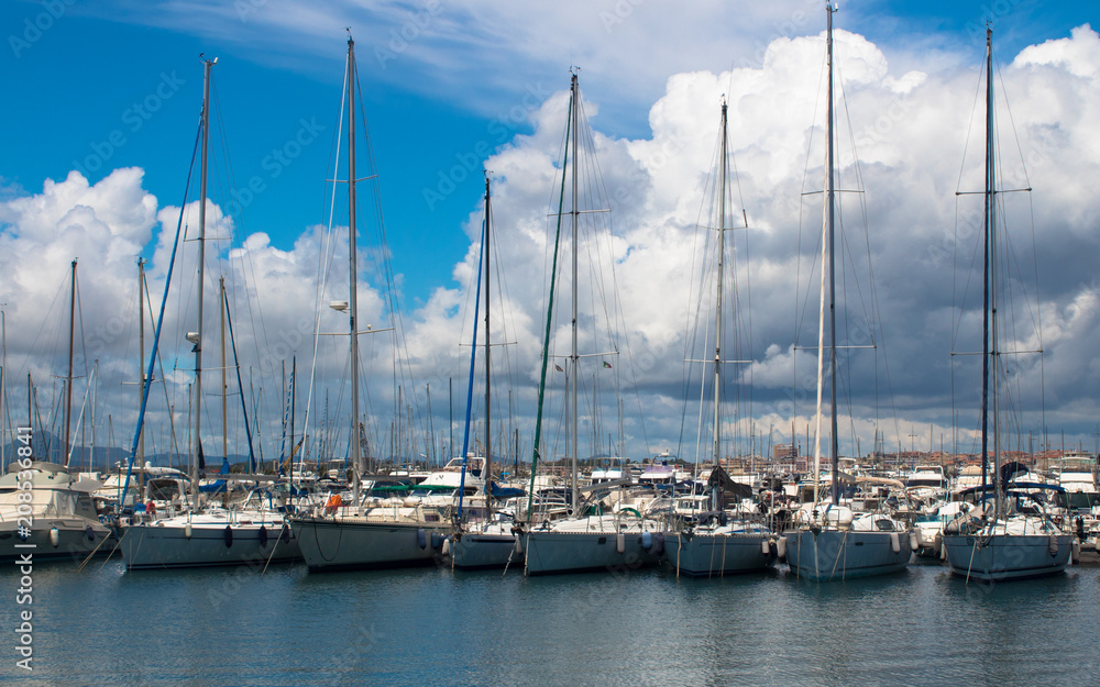 Berth with yachts under the clouds