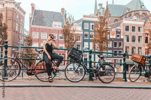 Photography portrait of a beautiful fashionable young girl in the streets of Amsterdam, the