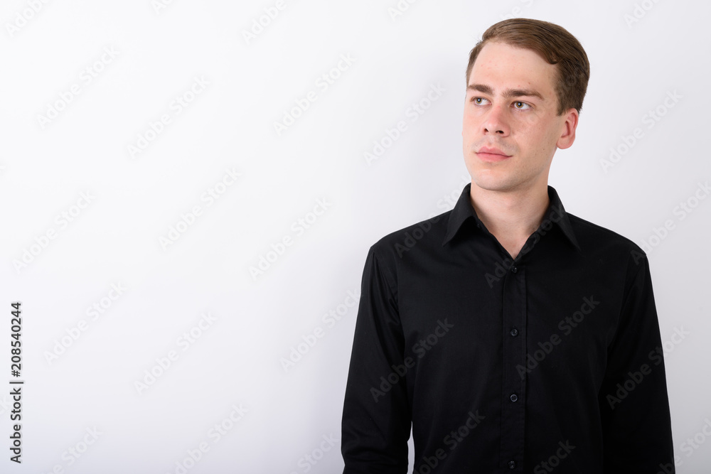 Young handsome businessman against white background Young handsome businessman against white background