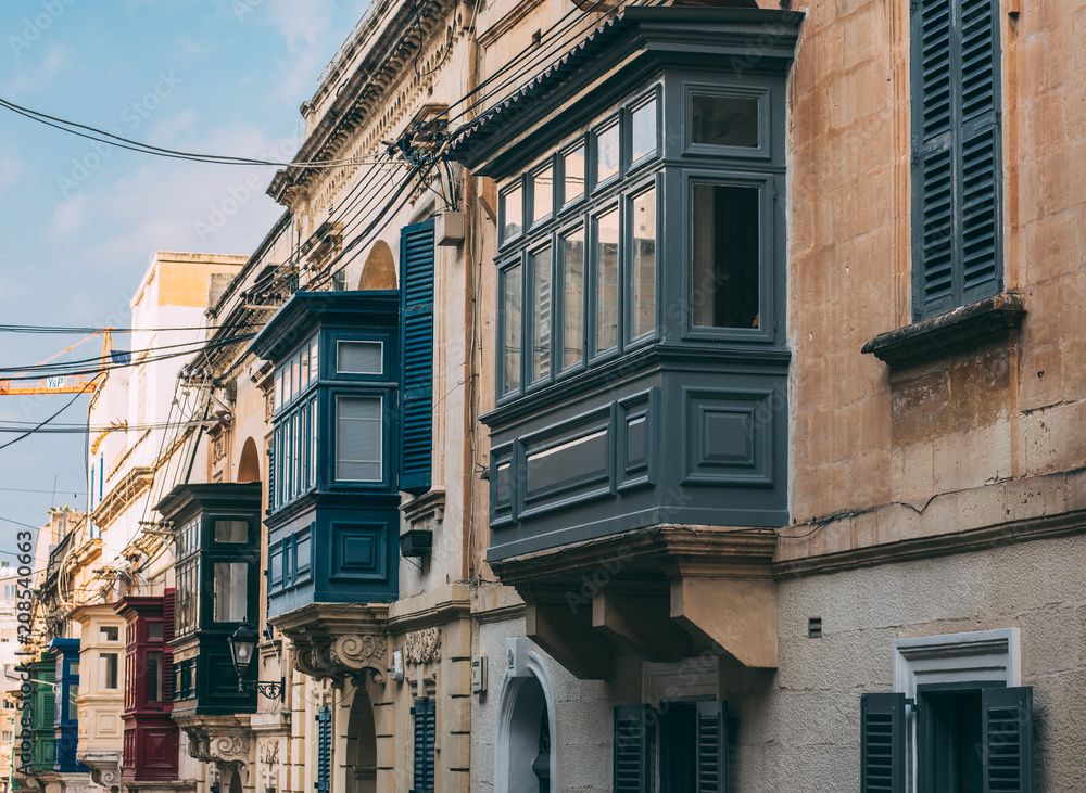 Street view in Sliema with traditional balconies, Malta