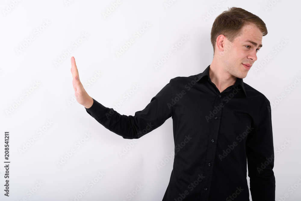 Young handsome businessman against white background Young handsome businessman against white background