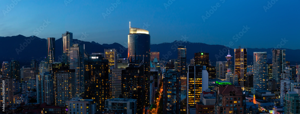 Vancouver, British Columbia, Canada - May 11, 2018: Aerial Panorama of the beautiful modern city during the night after sunset.