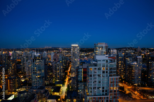 Aerial view of the Downtown City Buildings during the night after sunset. Taken in Vancouver  British Columbia  Canada.