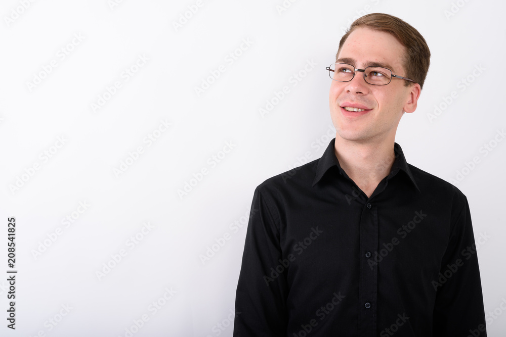 Young handsome businessman against white background