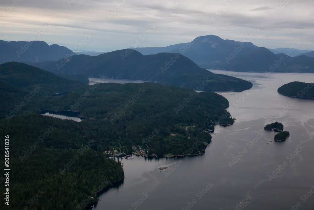 Aerial view of Skookumchuck Narrows during a vibrant cloudy sunset. Taken in Sunshine Coast, Northwest of Vancouver, British Columbia, Canada. Aerial view of Skookumchuck Narrows during a vibrant cloudy sunset. Taken in Sunshine Coast, Northwest of Vancouver, British Columbia, Canada.