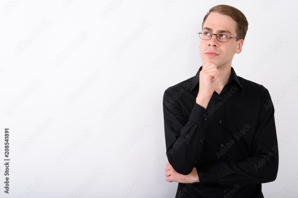Young handsome businessman against white background Young handsome businessman against white background