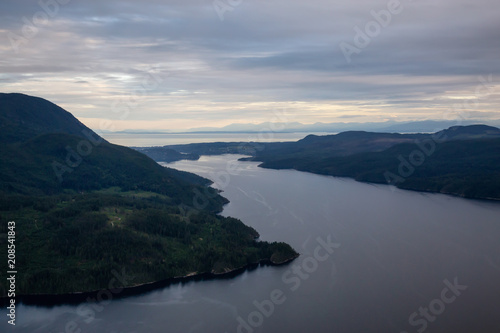 Aerial view of Sechelt Inlet during a vibrant cloudy sunset. Taken in Sunshine Coast, West of Vancouver, British Columbia, Canada.