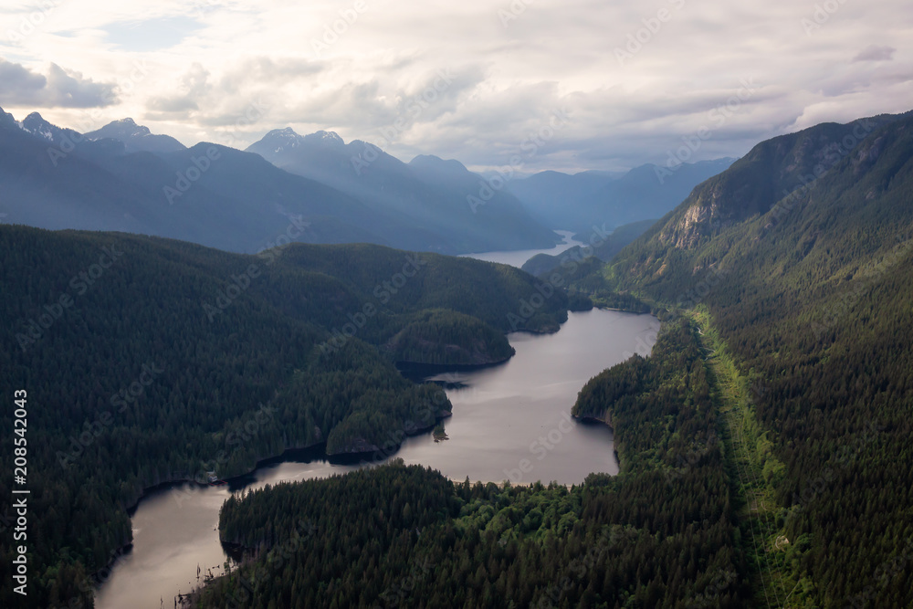 Aerial view of Buntzen Lake during a cloudy evening. Taken in Vancouver, British Columbia, Canada.