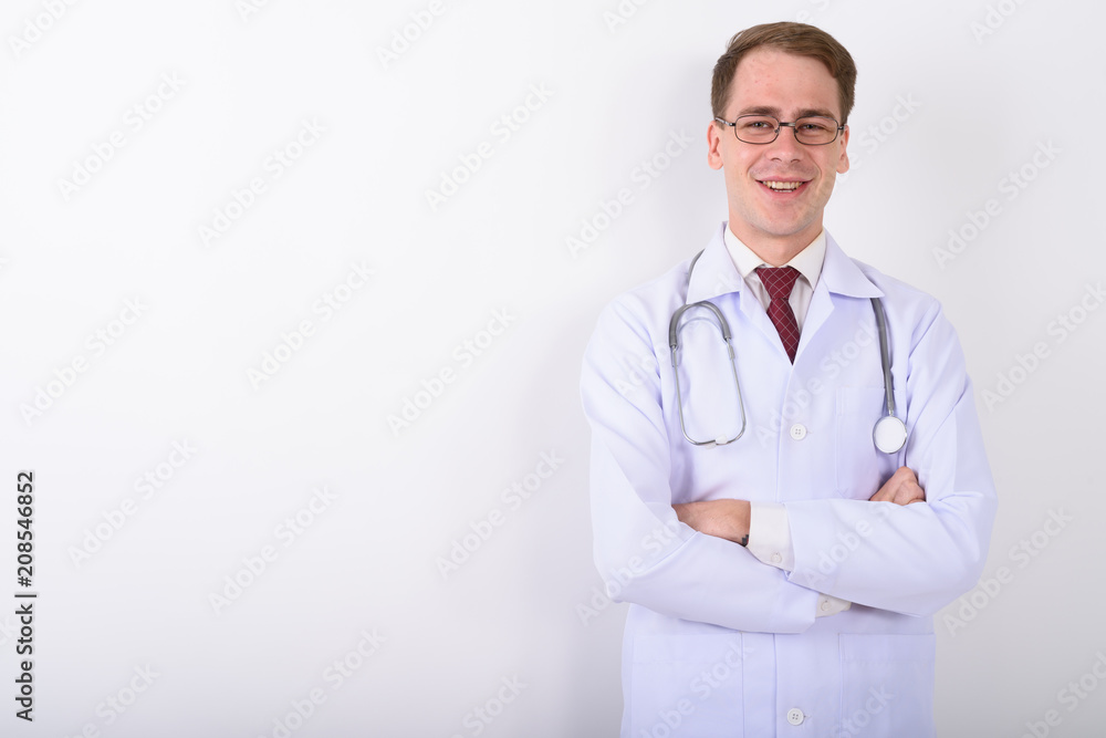 Young handsome man doctor wearing eyeglasses against white backg Young handsome man doctor wearing eyeglasses against white backg