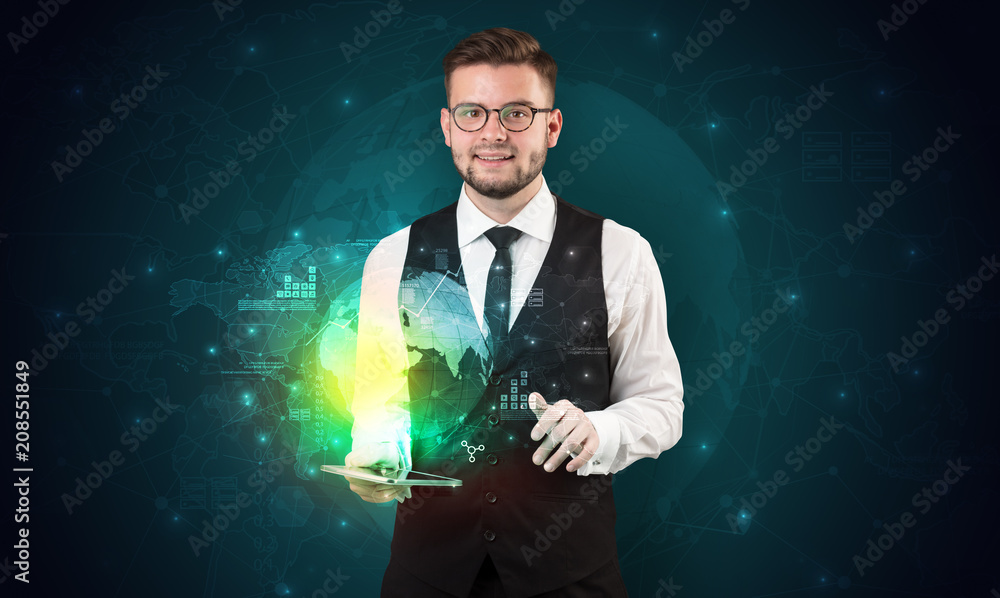 Spectacled businessman with global hologram concept and tablet on his hand
Spectacled businessman with global hologram concept and tablet on his hand