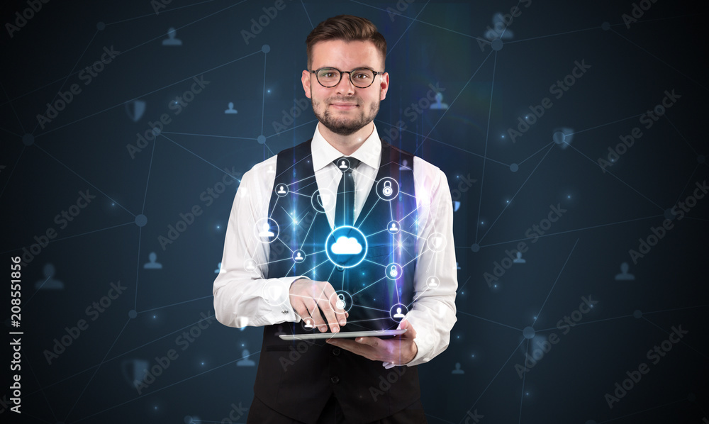 Secured cloud hologram on tablet holded by spectacled young businessman in suit
Secured cloud hologram on tablet holded by spectacled young businessman in suit