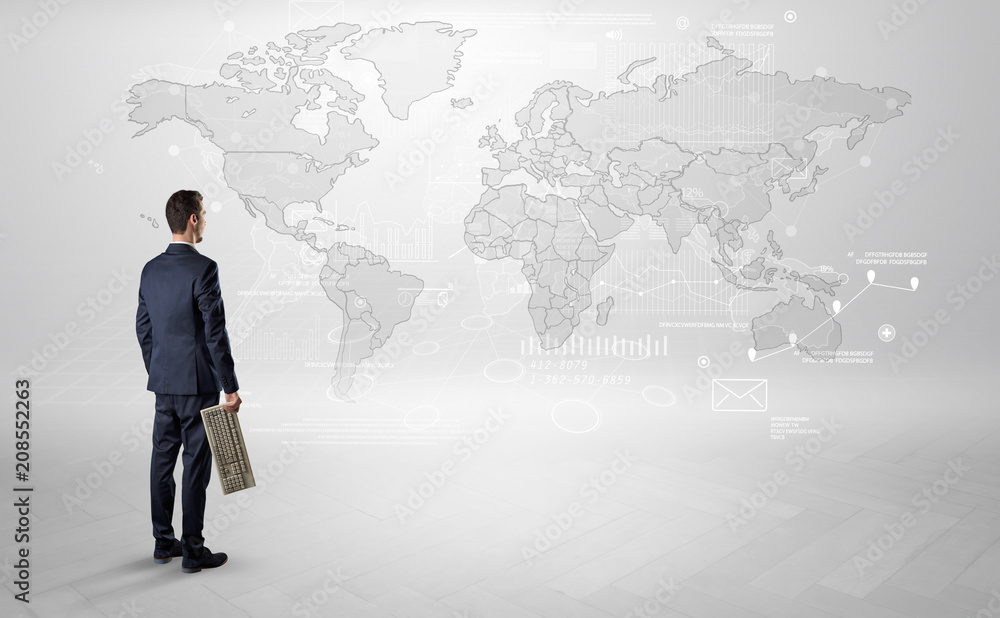 Businessman standing with his back and looking at a worldwide map with objects in his hand
Businessman standing with his back and looking at a worldwide map with objects in his hand