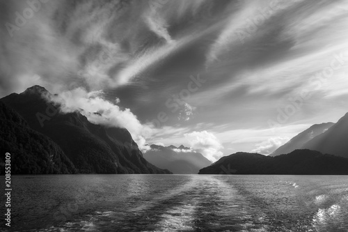 Dramatic clouds and alpine scenery at Lake Manapouri in black and white -New Zealand, South Island.