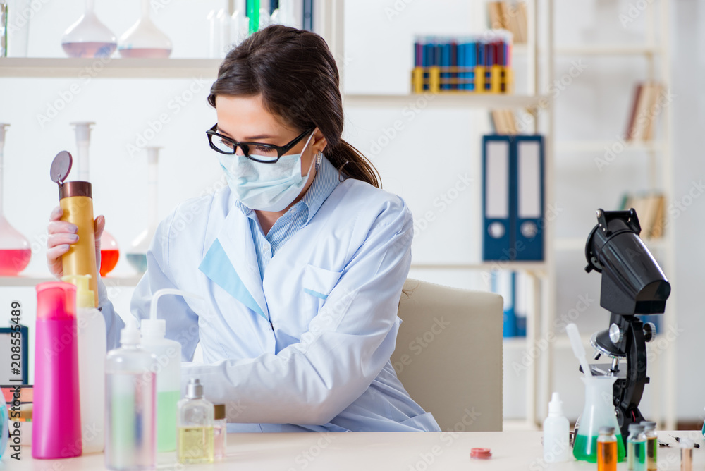 Lab chemist checking beauty and make-up products Lab chemist checking beauty and make-up products