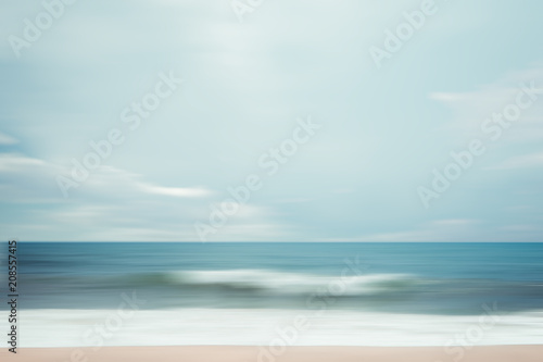 A seascape abstract beach background. panning motion blur with a long exposure, pastel colors in a vintage and retro style.