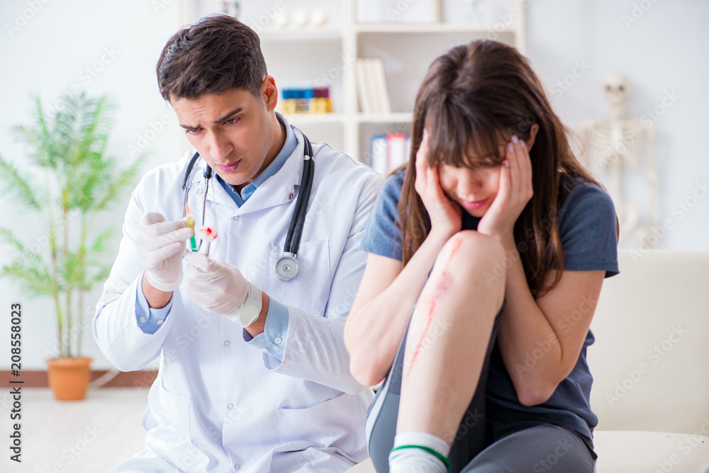 Fototapeta premium Patient visiting doctor after sustaining sports injury