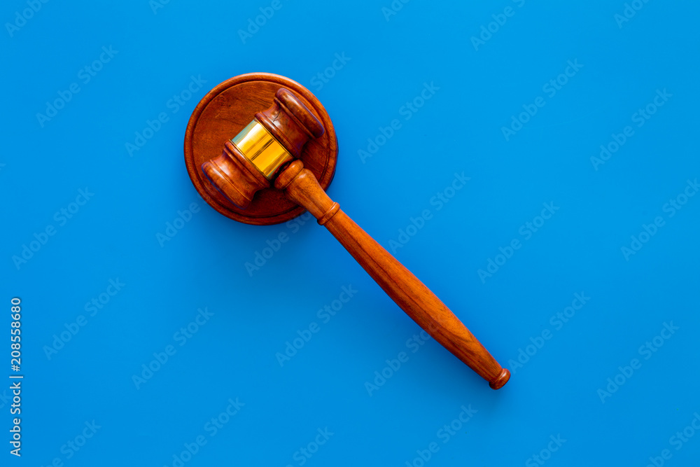 Law and court. Lawyer, attorney, judge concept. Judge gavel on blue background top view copy space