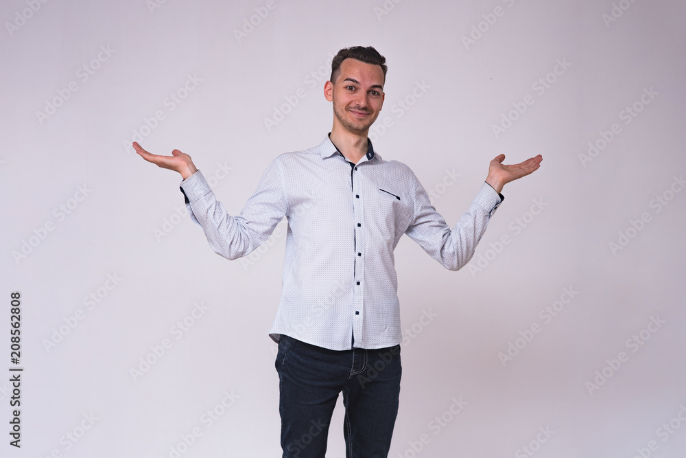portrait of a cute young brunette man on a white background with different emotions portrait of a cute young brunette man on a white background with different emotions