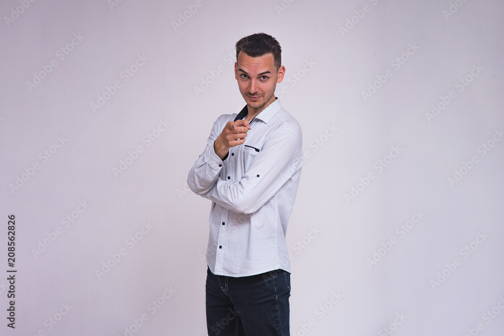 portrait of a cute young brunette man on a white background with different emotions portrait of a cute young brunette man on a white background with different emotions