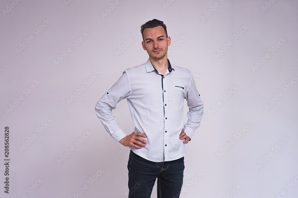 portrait of a cute young brunette man on a white background with different emotions