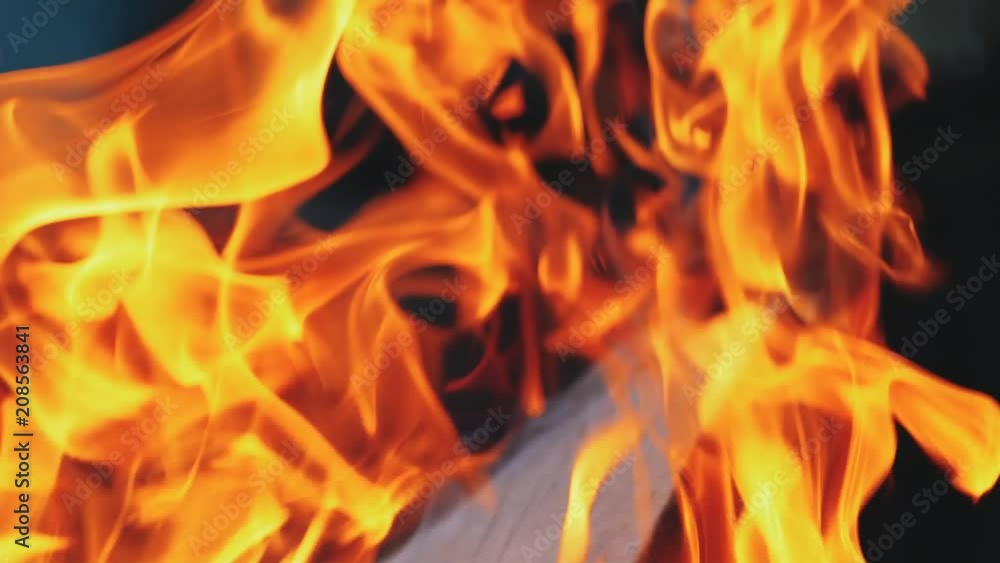 Burning fire in a home fireplace. Slow motion Burning fire in a home fireplace. Slow motion