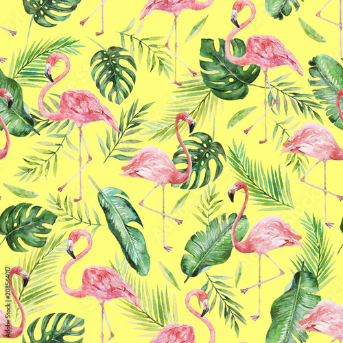 Green palm leaves and flamingo on the yellow background. Watercolor hand painted seamless pattern. Tropical illustration. Jungle foliage.