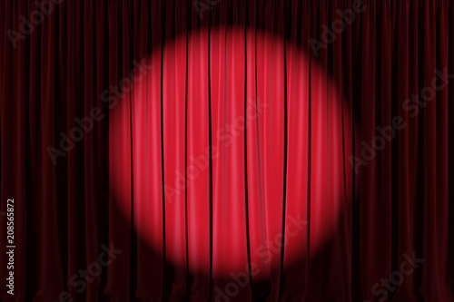 Background image of red velvet stage curtain with spotlight