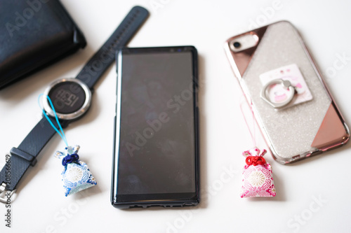 Japanese amulets or lucky charms. A couple amulets Japanese charms to bring good luck in love and other personal belongings. Selective focus on the pink amulet. love and relationship concept. photo